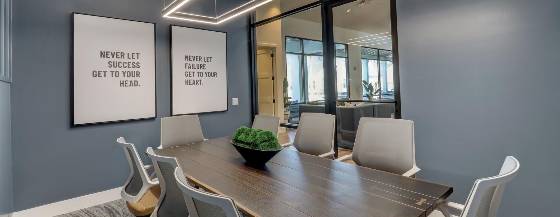 a conference room with a table and chairs