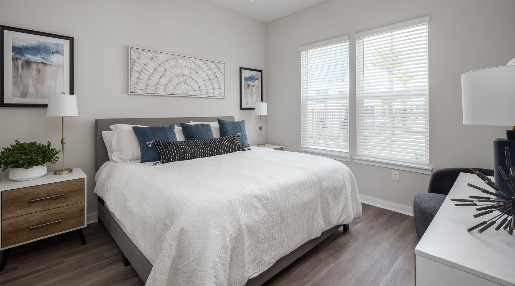 a bedroom with a bed and a fan